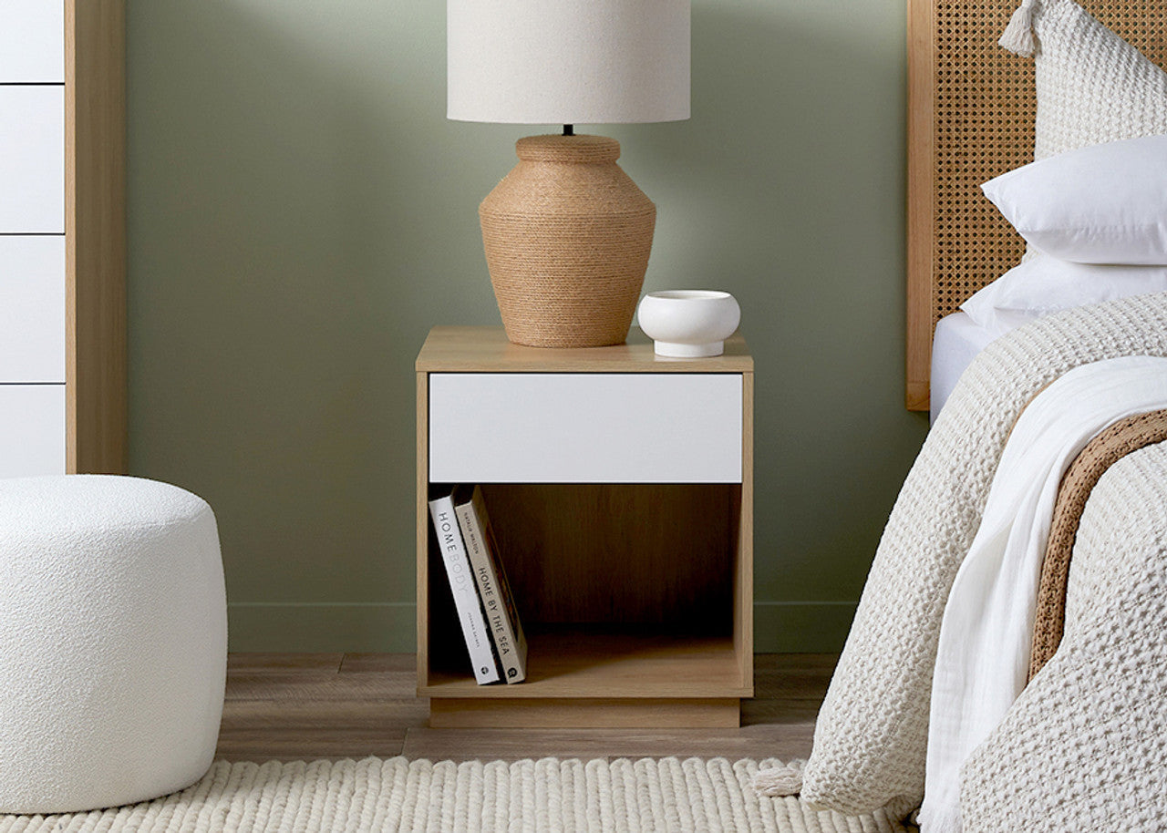 Coastal bedside pedestal by Imperial Homes with white drawer and wooden open shelf in bedroom setting