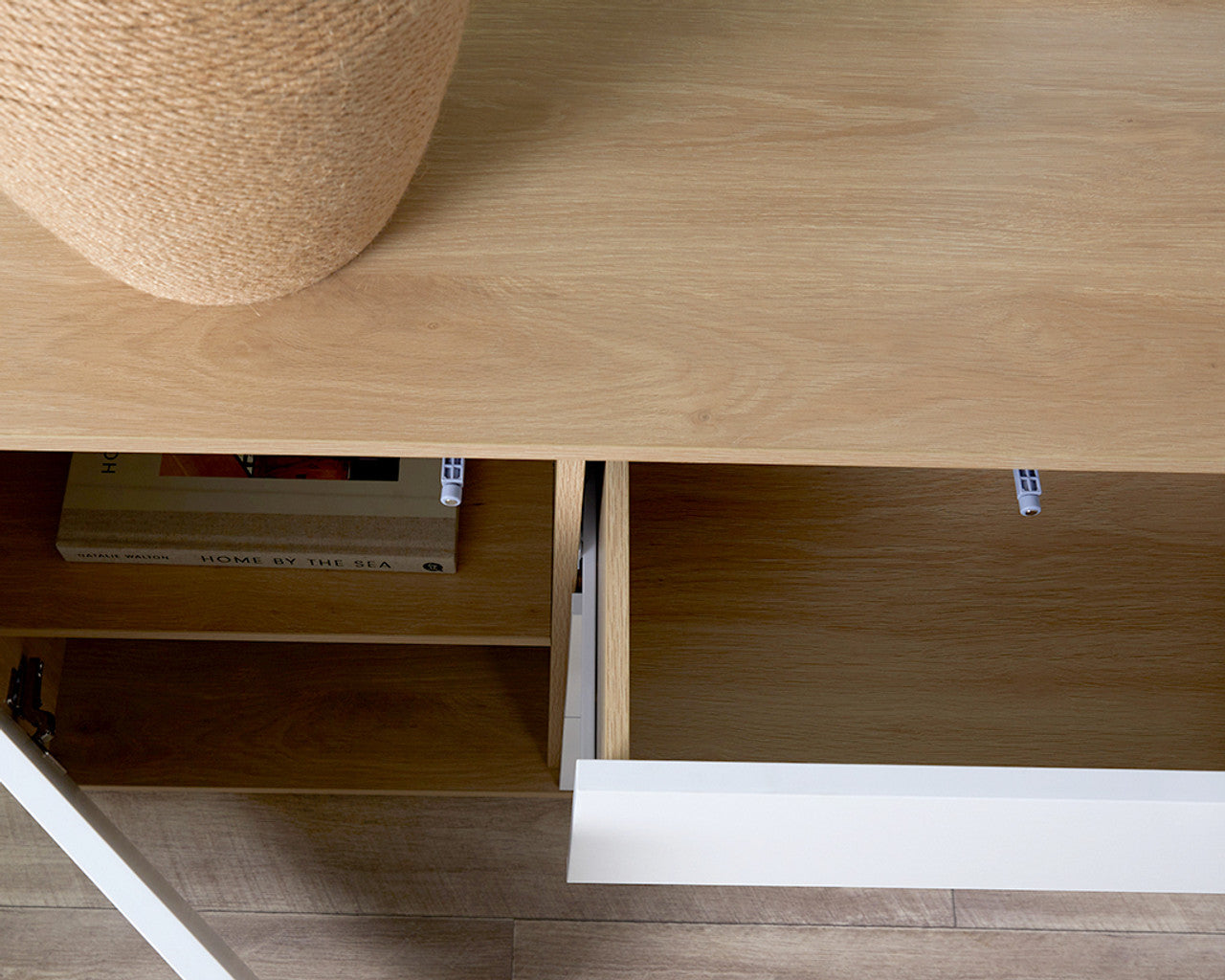 Open drawer and storage space of Imperial Homes coastal buffet sideboard with wood and white finish
