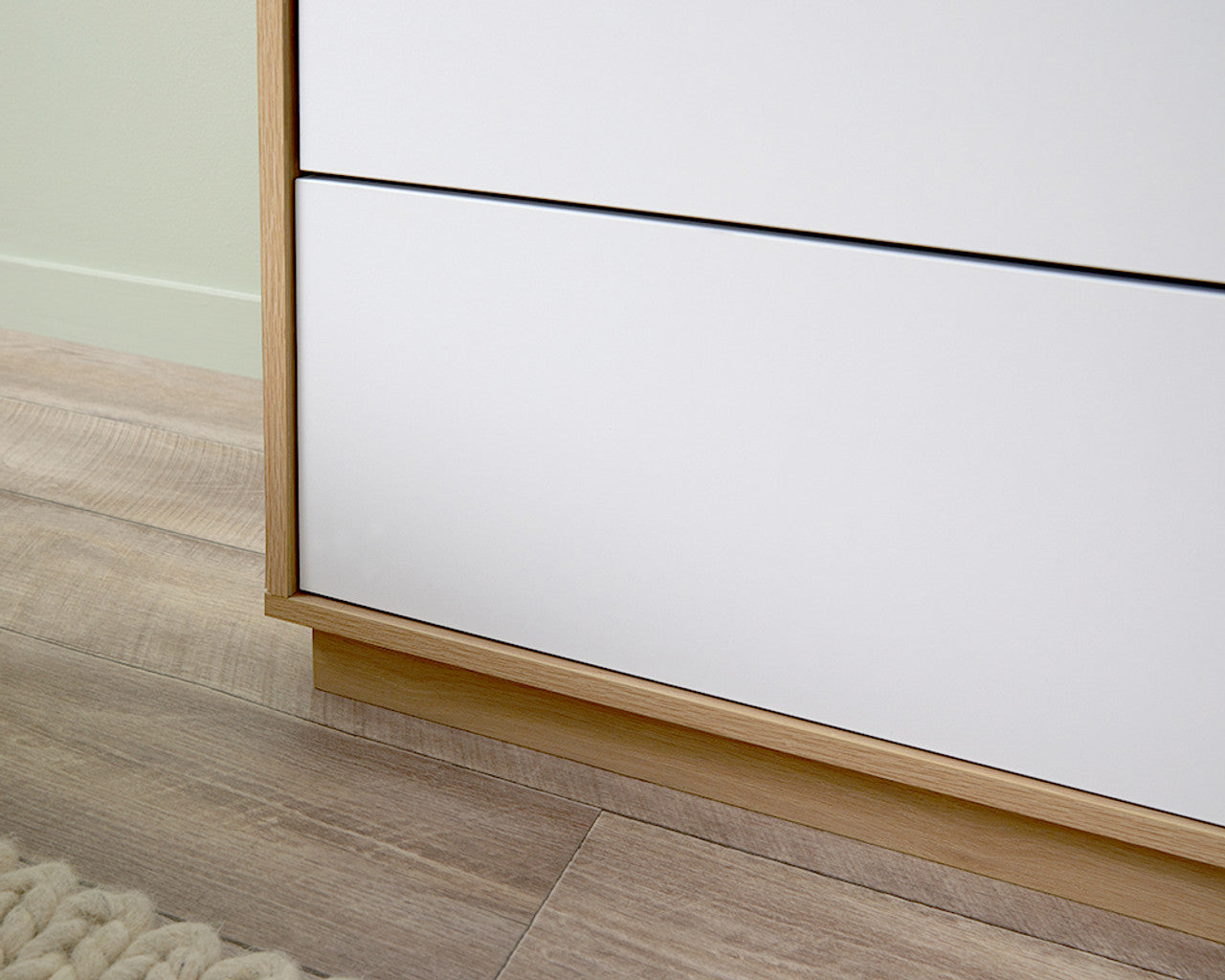 Close-up of Imperial Homes coastal tallboy chest of drawers showing wood frame and white drawer fronts