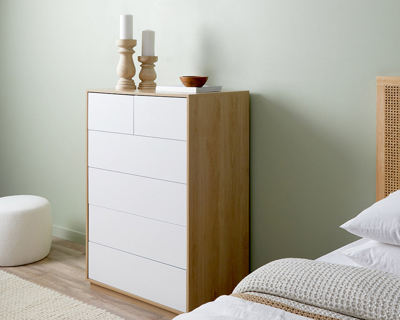 Imperial Homes coastal tallboy chest of drawers in wood and white finish placed in a bedroom