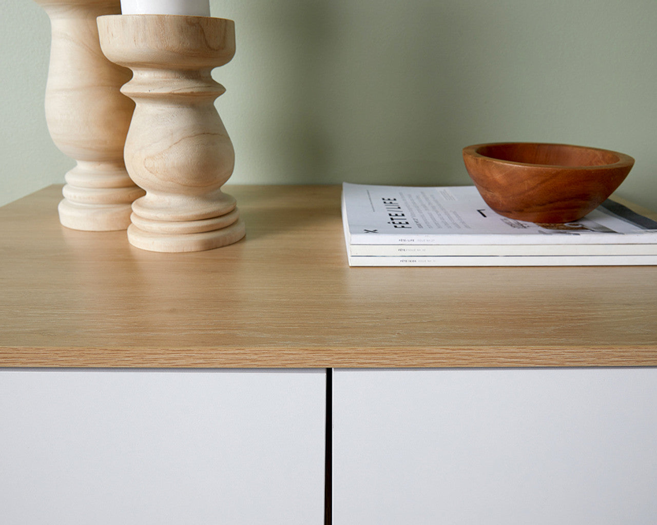 Coastal tallboy chest of drawers by Imperial Homes with light wood top and white drawers featuring decorative wooden items and a bowl
