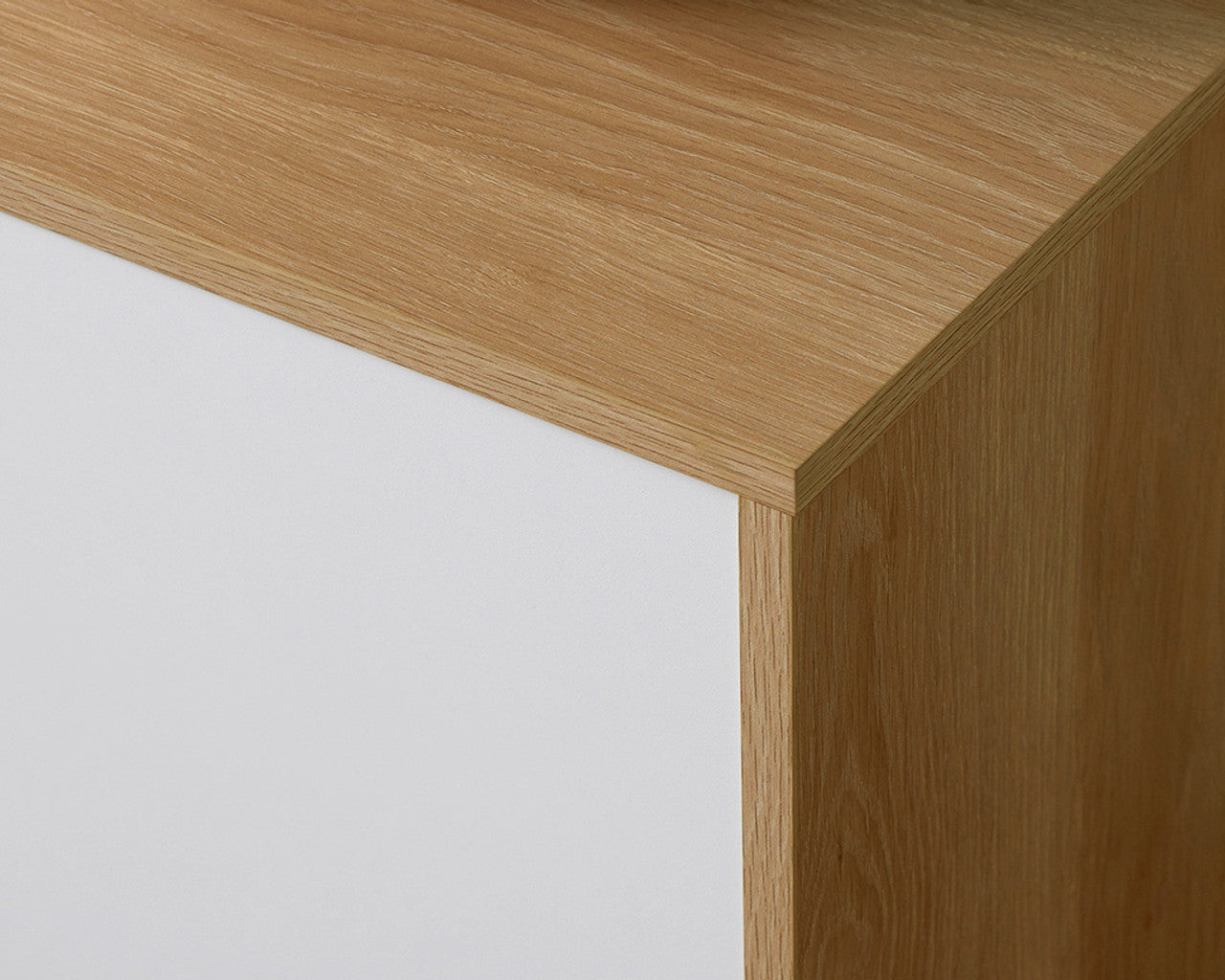 Close-up detail of Imperial Homes coastal TV unit showing wood grain and white panel finish