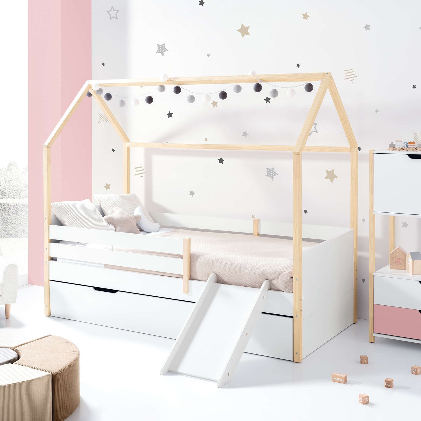 Imperial Homes House Teepee Bed with wooden frame, white base, and slide in a kids’ bedroom