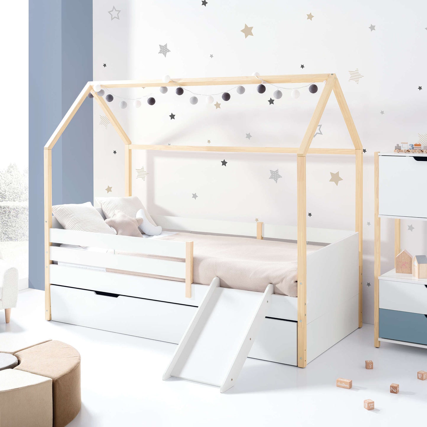 Imperial Homes House Teepee Bed with slide and star wall decals in a bright kids bedroom