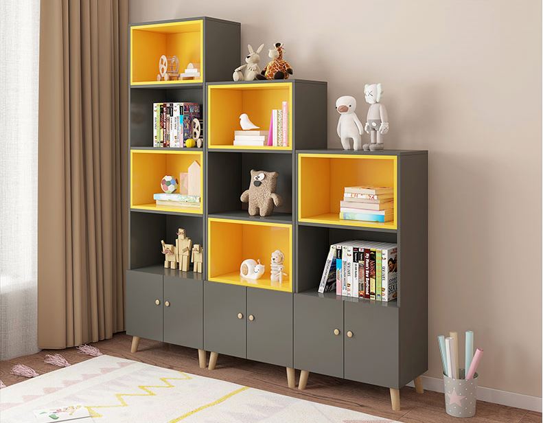 Modern bookshelf with cabinets in gray and yellow featuring open shelves and closed storage compartments