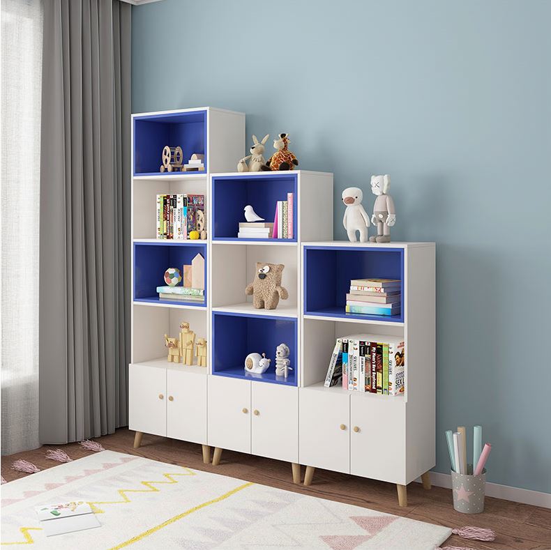 Imperial Homes modern bookshelf with cabinets in white and blue, decorated with books and toys in a living room