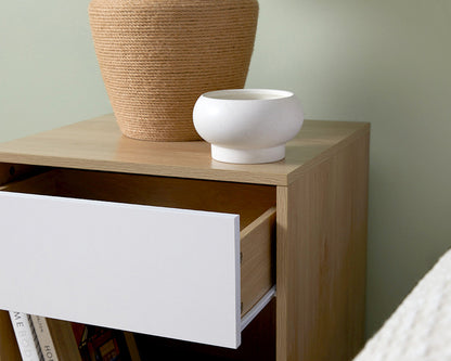Imperial Homes coastal bedside pedestal with natural wood finish and white drawer partially open