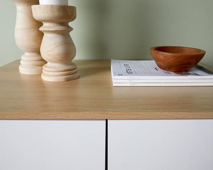 Coastal tallboy chest of drawers by Imperial Homes with light wood top and white drawers featuring decorative wooden items and a bowl