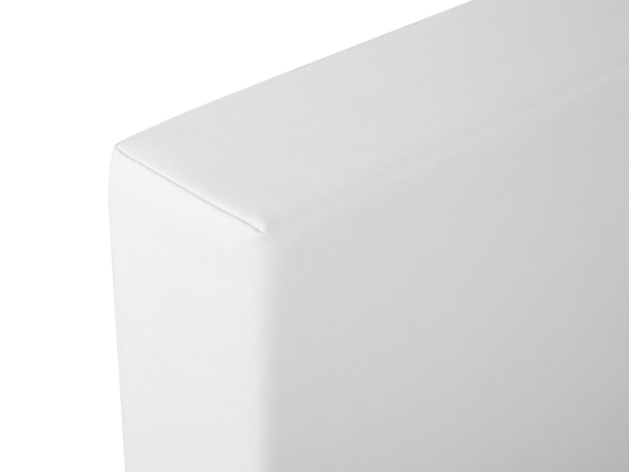 Close up of white minimalist platform bed corner with smooth fabric upholstery by Imperial Homes
