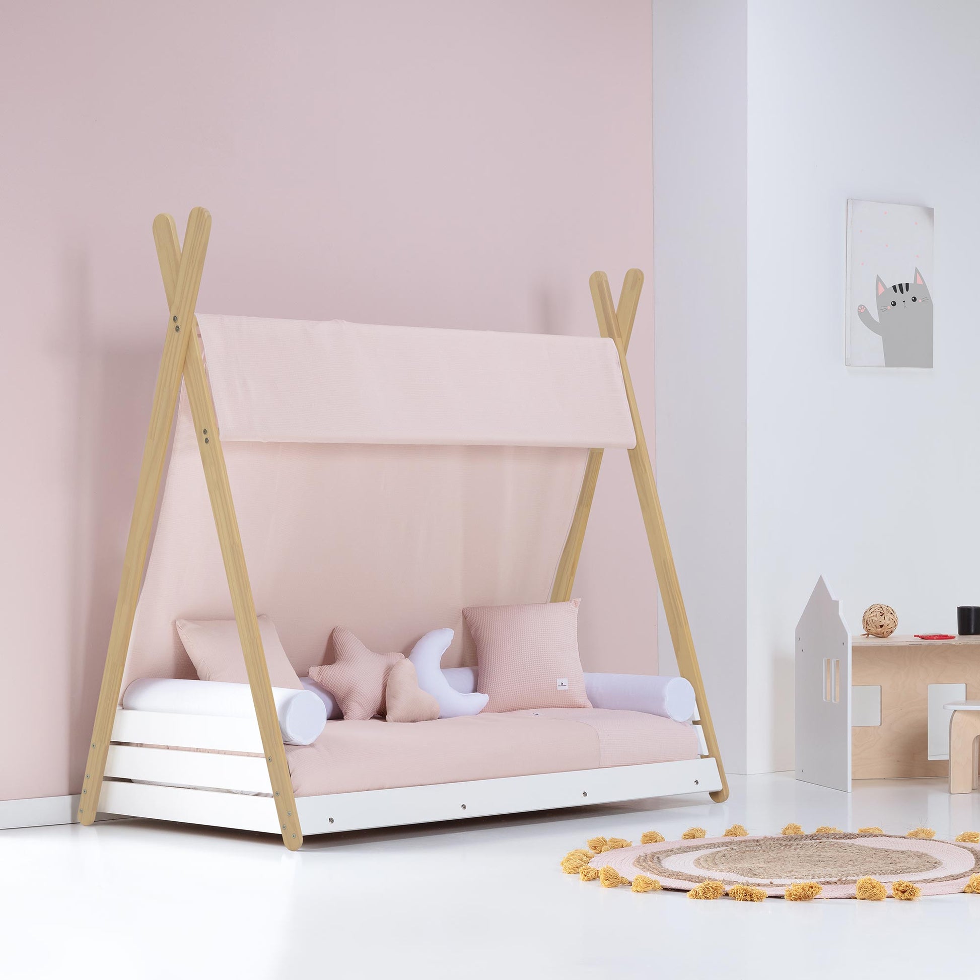 Imperial Homes Teepee Bed with wooden frame and soft pink cushions in a kids room
